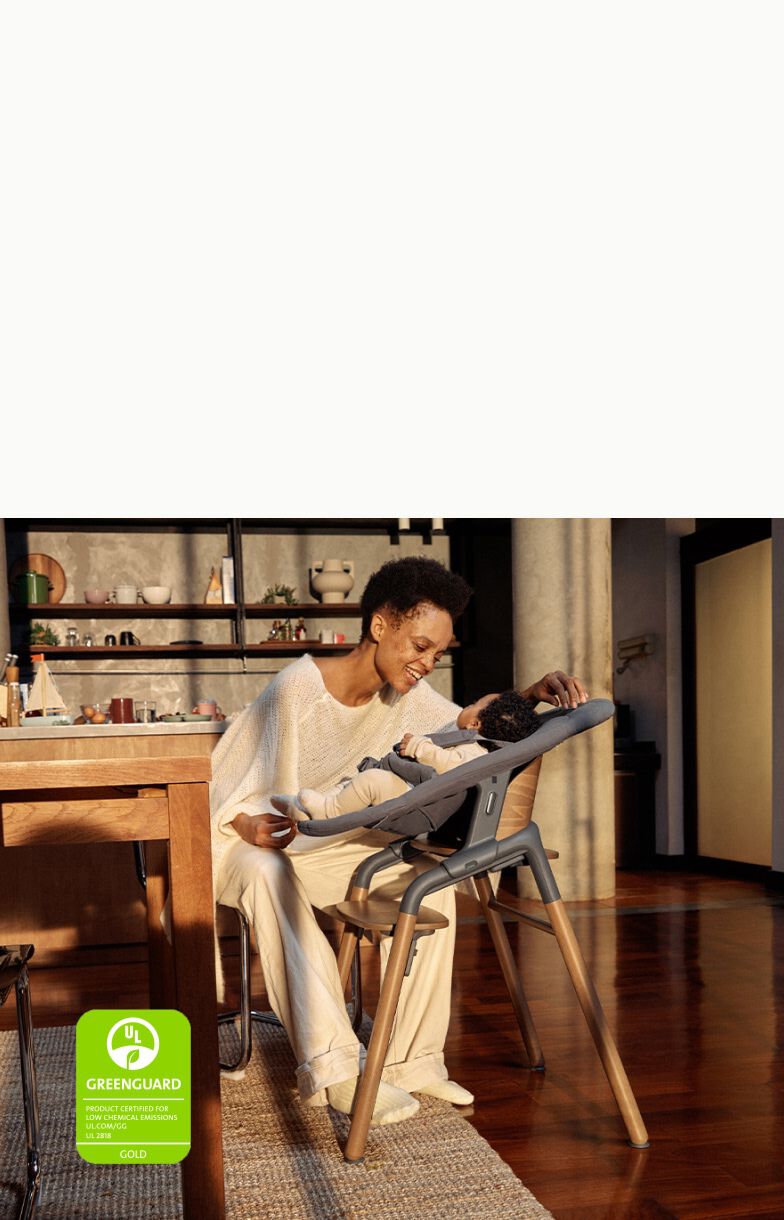 Mom in kitchen with baby in Bugaboo Giraffe
