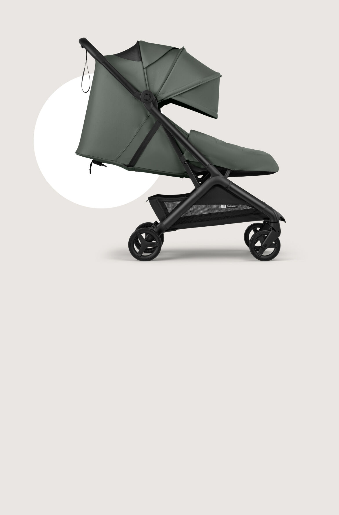 The Bugaboo Butterfly 2 Plus travel stroller in green fabrics, showing the lay-flat seat and the built-in newborn foot cover.