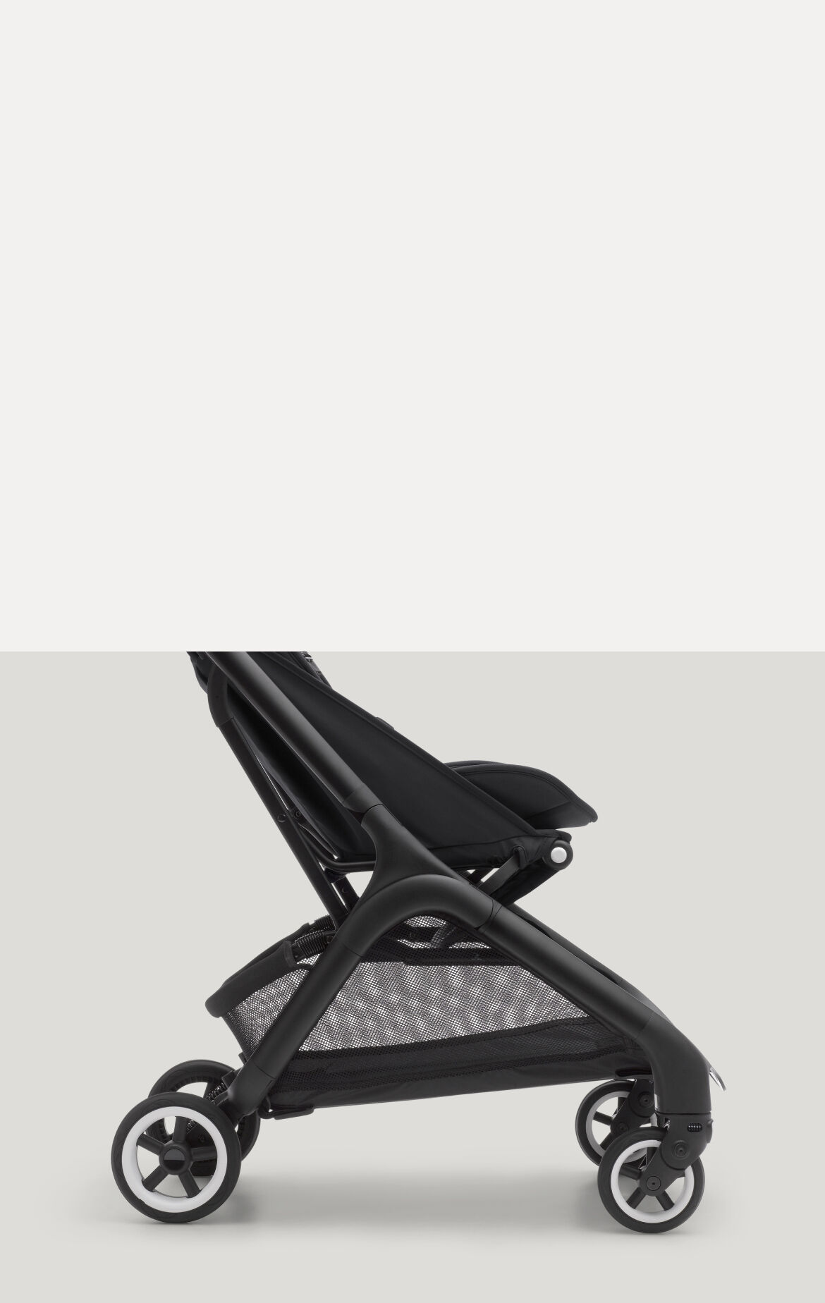 A sideway close-up of the Bugaboo Butterfly compact travel stroller's underseat basket.