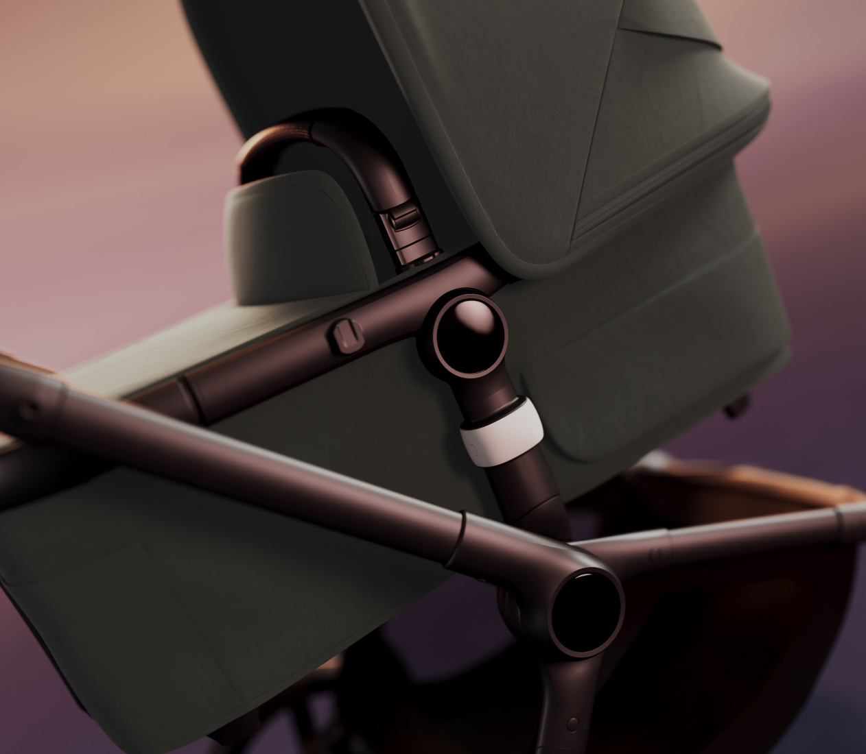 A close-up, tilted shot of the Bugaboo Fox 5 all-terrain pram, highlighting the sleek chassis and premium fabrics.
