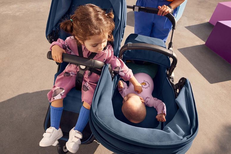 Two kids in double stroller