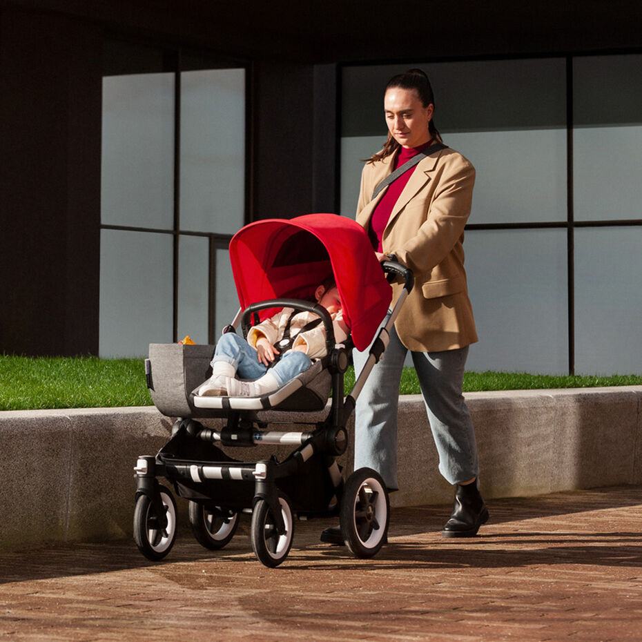 Woman walking with child in stroller