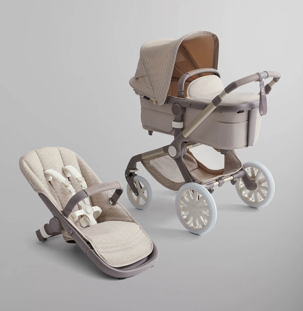 Bugaboo X Kith Limited Edition stroller with a bassinet and a seat. The stroller features an exclusive white colorway from the Kith fashion brand.