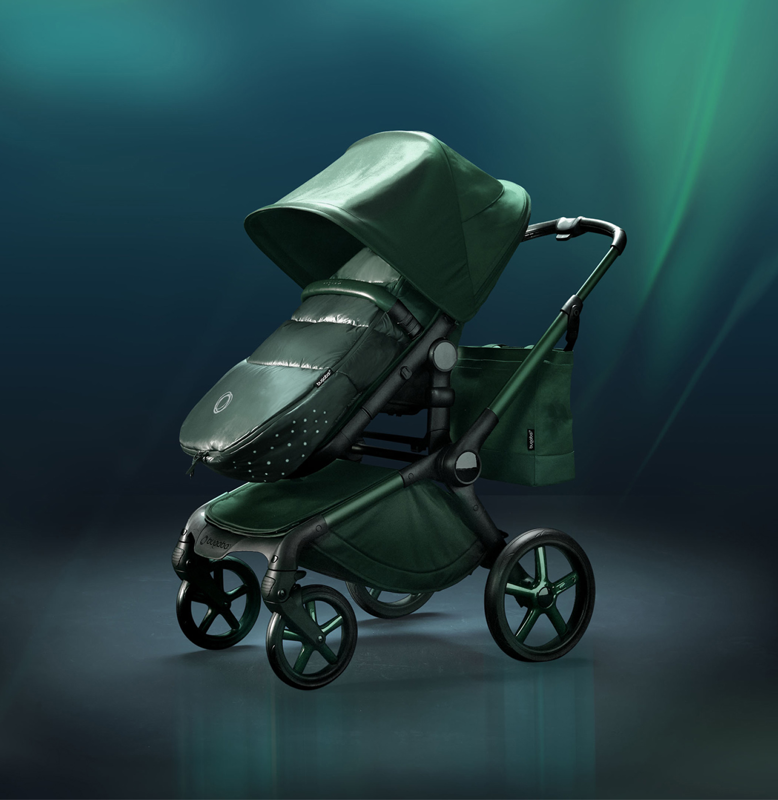 A Bugaboo Fox 5 Noir Limited Edition stroller in Midnight Green fabrics, against a green aurora gradient background.
