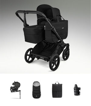 En Bugaboo Donkey 6 omvandlingsbar barnvagn med liggdel, visas med olika babytillbehör i paketet