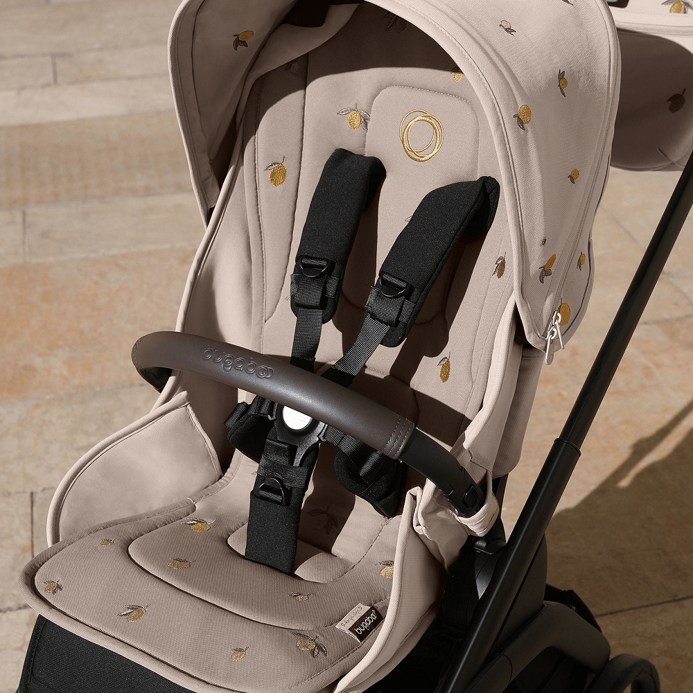 A Bugaboo stroller with Bugaboo X Konges Sløjd Limited Edition seat liner, featuring Konges Sløjd's signature lemon print.