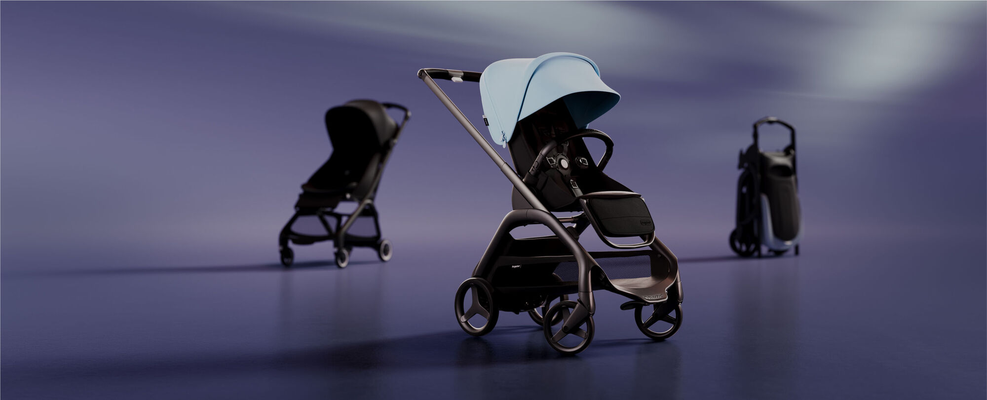 A lineup of 3 strollers. At the front is a Bugaboo Dragonfly with Skyline Blue sun canopy. On the left is a Bugaboo Butterfly with Midnight Black fabrics. On the right is a self-standing folded Bugaboo Dragonfly.