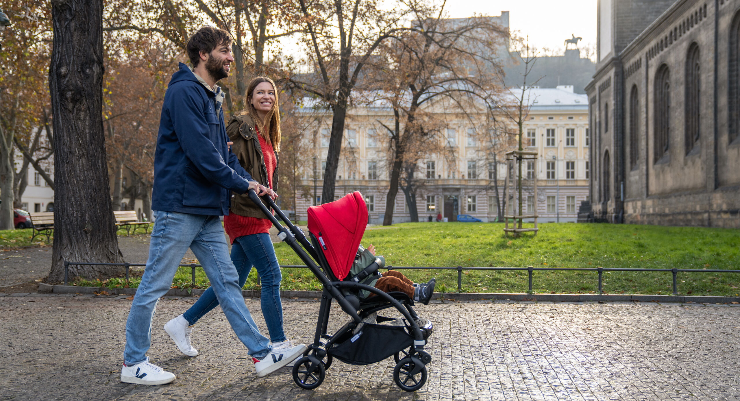 Parents pushing stroller