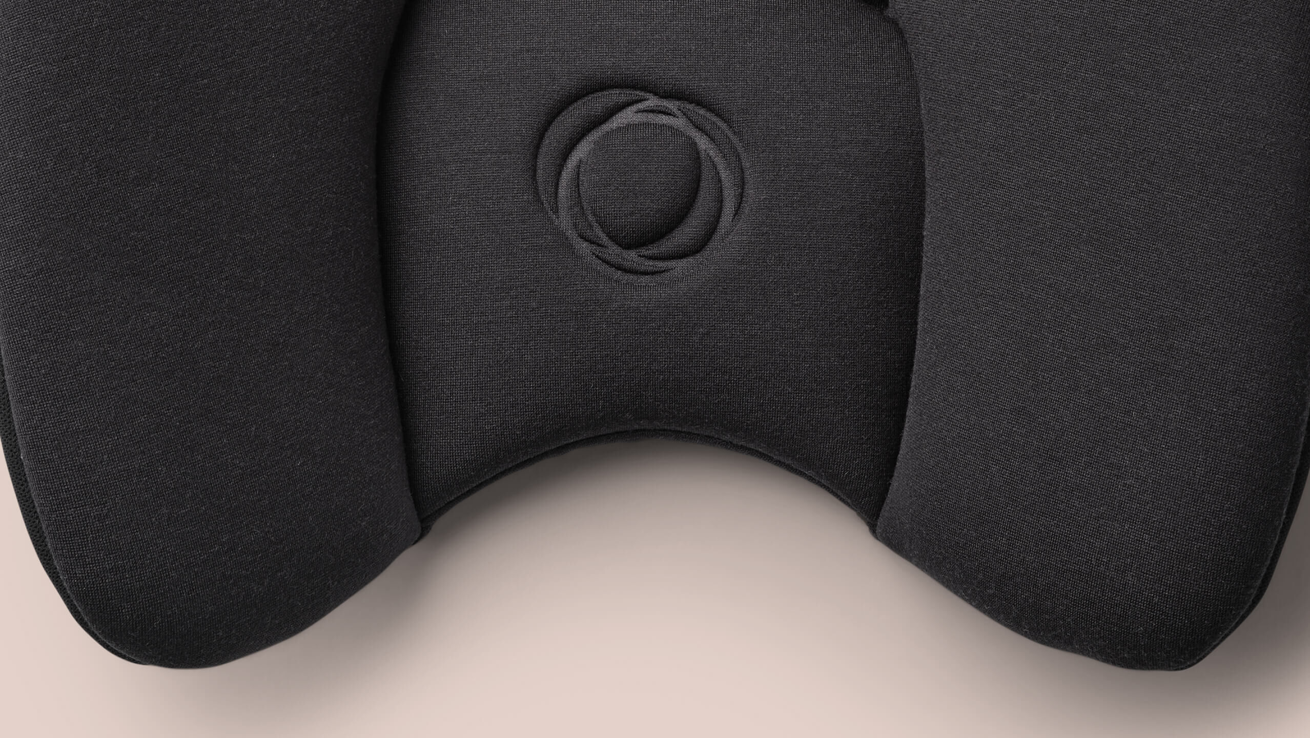 A close-up of the padded fabric material of the Bugaboo Turtle Air Shield by Nuna car seat.