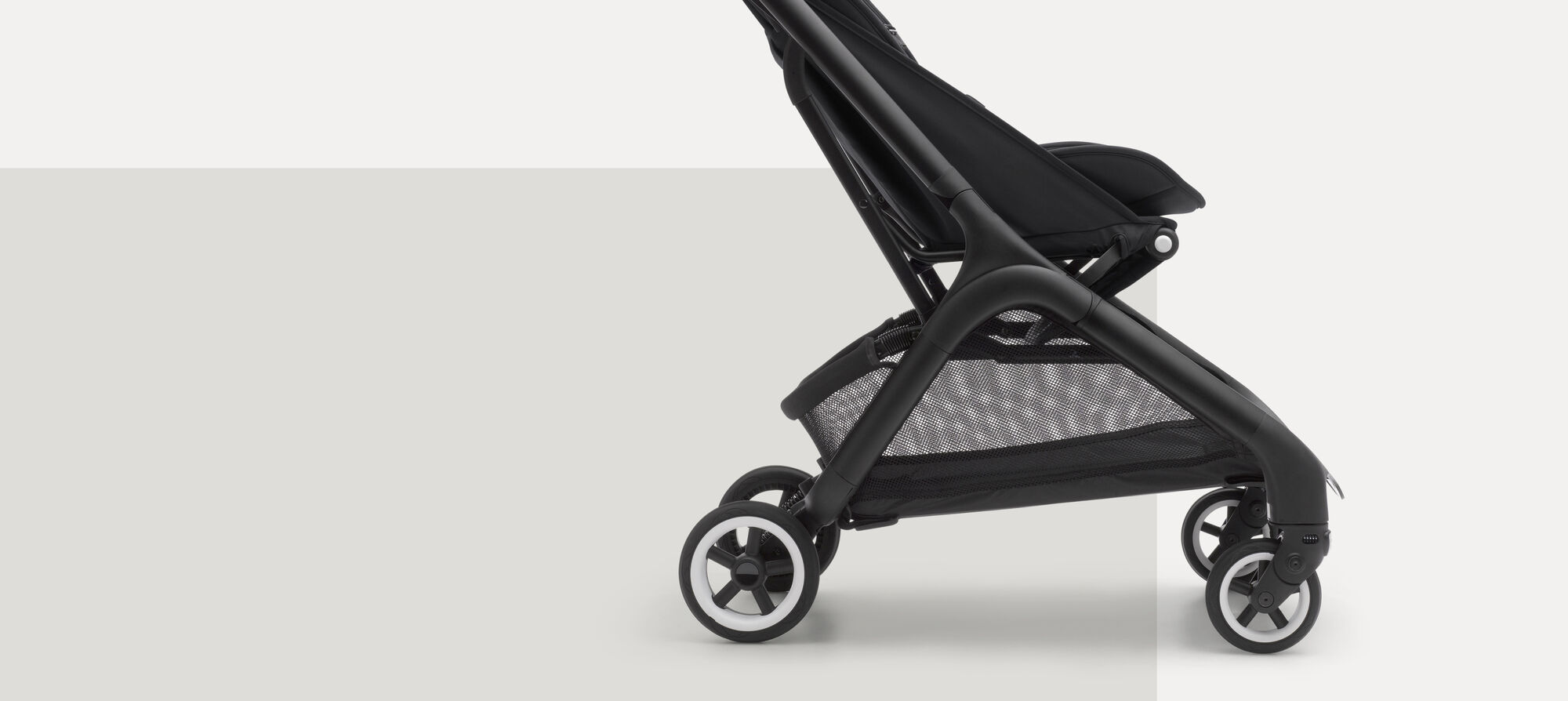 A sideway close-up of the Bugaboo Butterfly compact travel stroller's underseat basket.