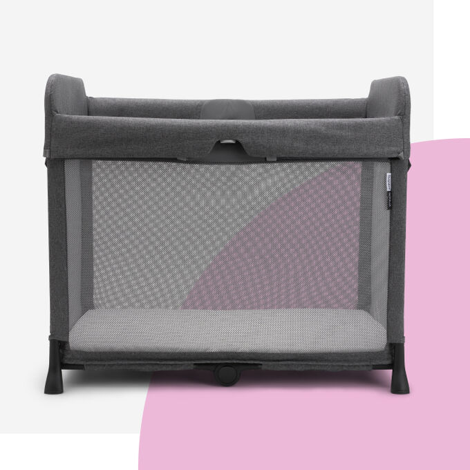 A Bugaboo Stardust travel cot in grey.