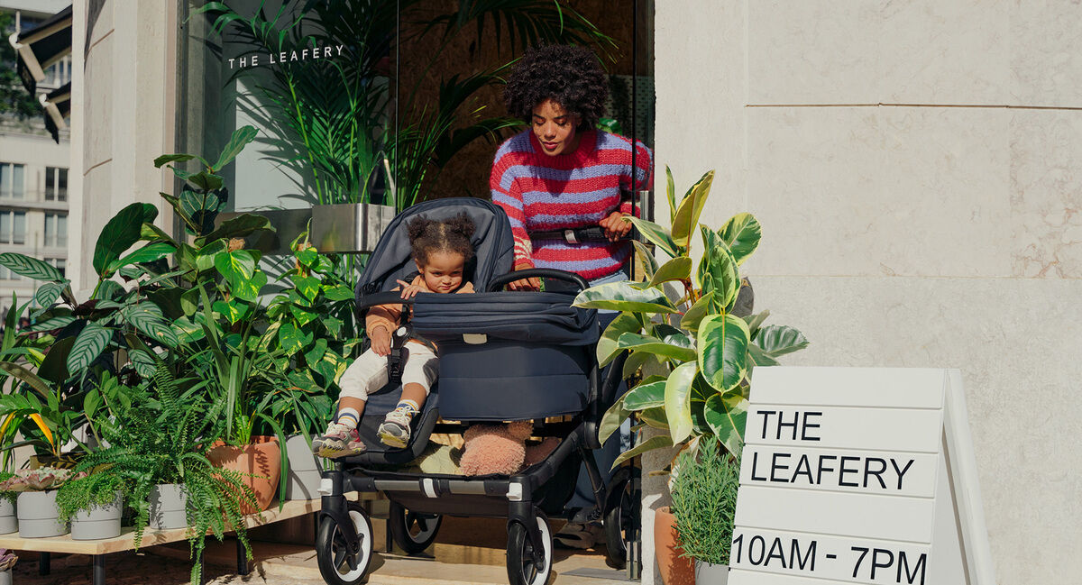 Mom pushing Bugaboo stroller