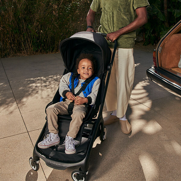 Child sitting in Butterfly stroller