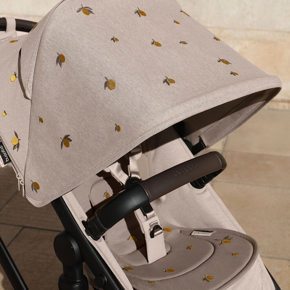 A Bugaboo stroller with Bugaboo X Konges Sløjd Limited Edition sun canopy, featuring Konges Sløjd's signature lemon print.