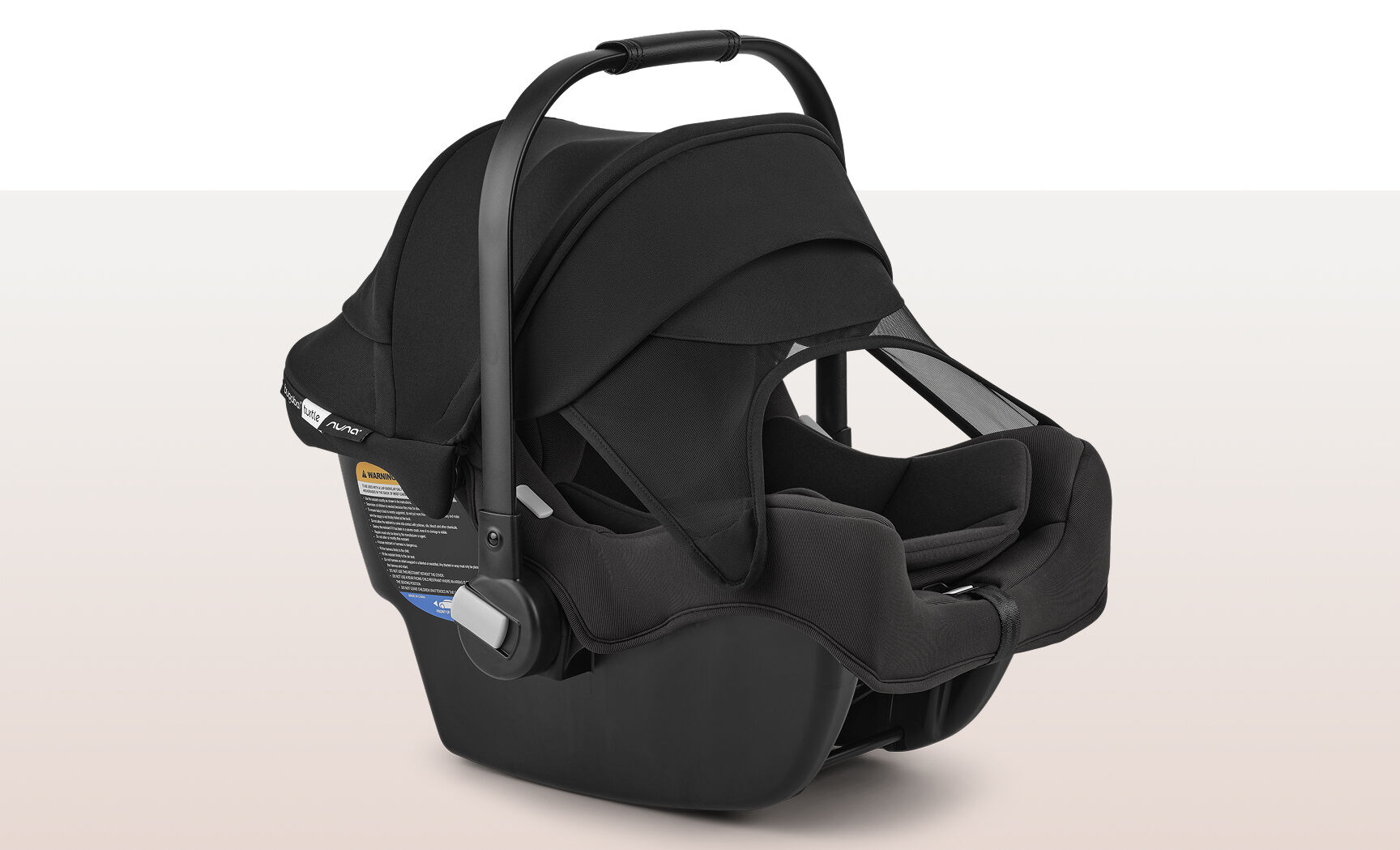 A Bugaboo Turtle by Nuna car seat with the sun canopy and visor fully extended.