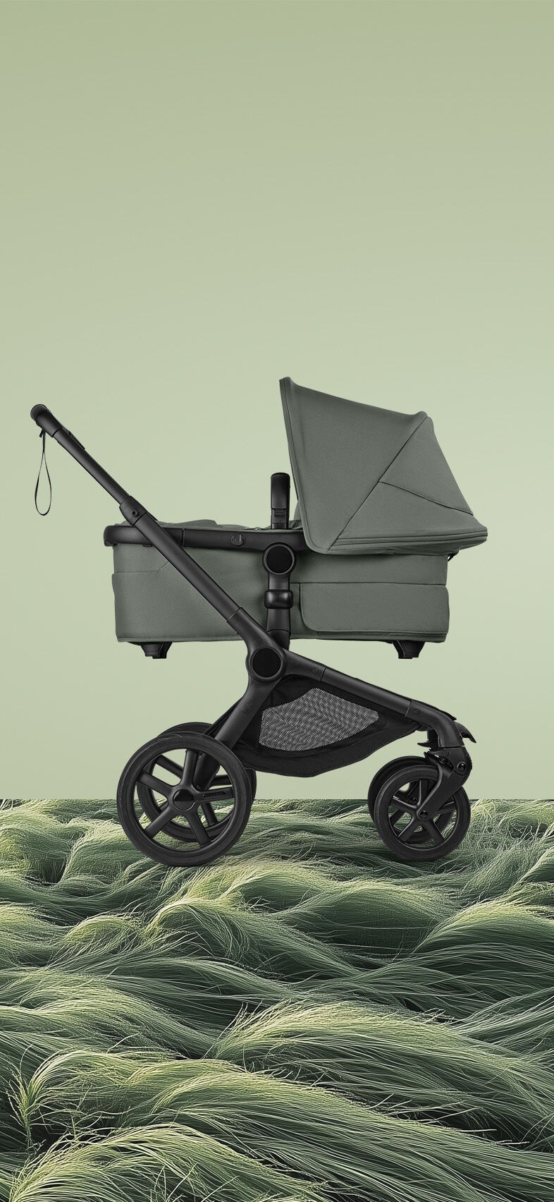 Side view of a Bugaboo Fox 5 Renew bassinet stroller with Forest Green fabrics. Below, a CGI image depicts a windswept green field with tall blades of grass bending horizontally in the strong wind.