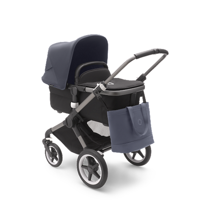Blue Bugaboo nappy changing bag on a Bugaboo pushchair