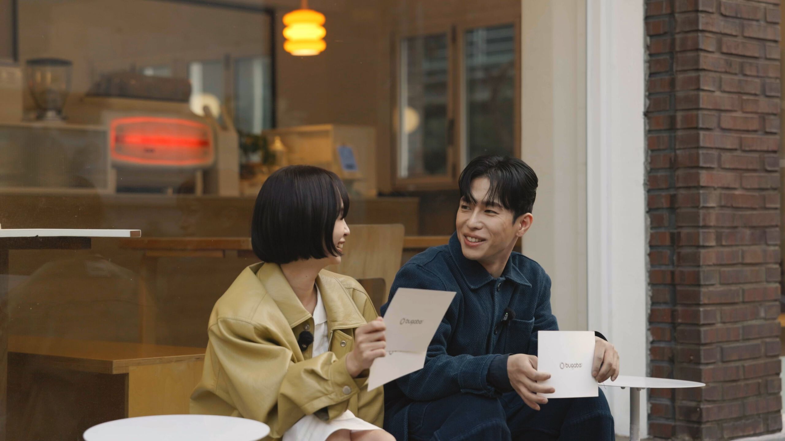 Video: Parents Hanbit and Seungmin sit outside of a cafe in Seoul and discuss their experience raising a newborn together.