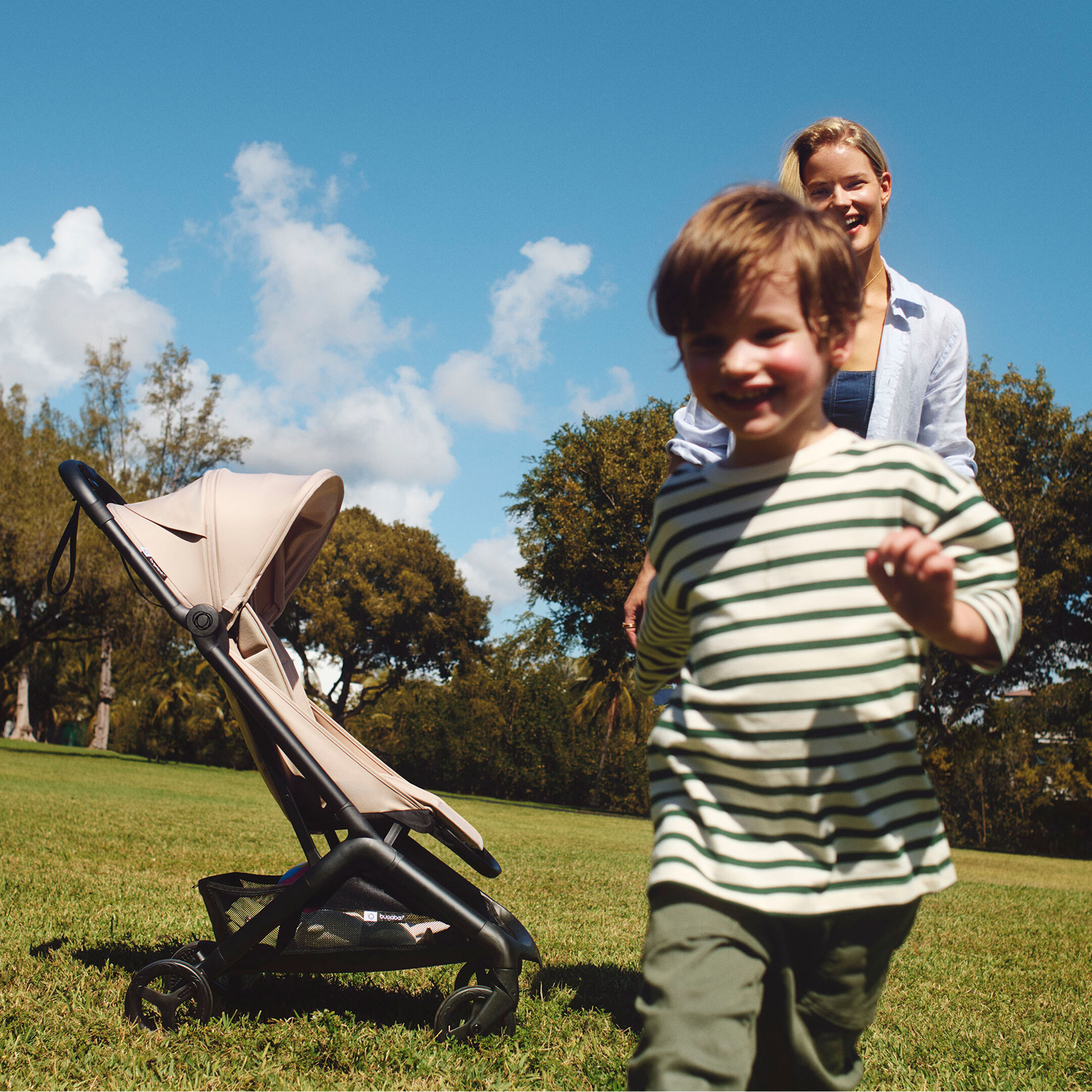 Mother and son playing next to Bugaboo Butterfly 2
