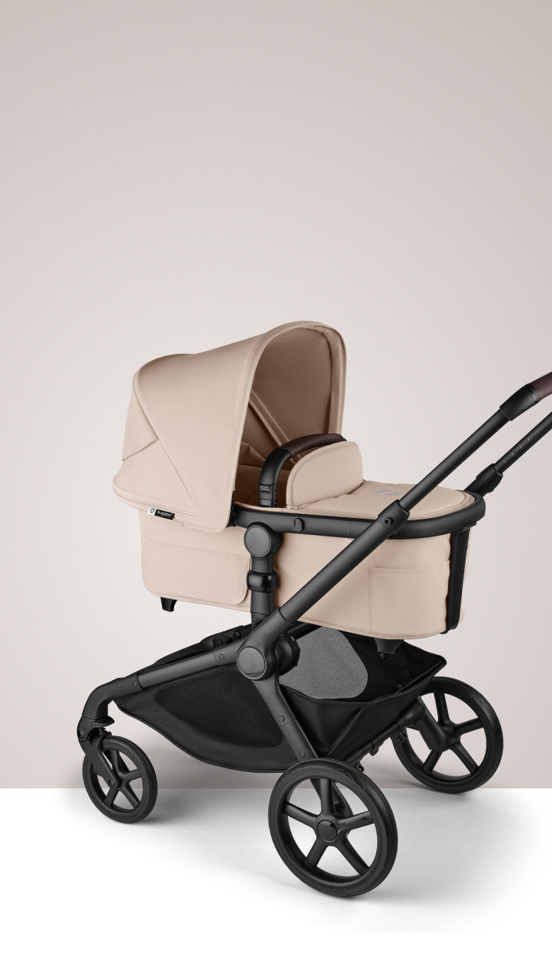 A Bugaboo Kangaroo single-to-double pram in Desert Taupe fabrics, with a bassinet.