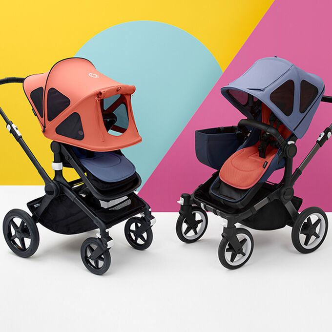 Two Bugaboo strollers fitted with colorful summer accessories.