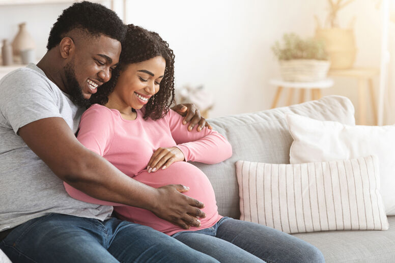 Pregnant woman in third trimester with her partner