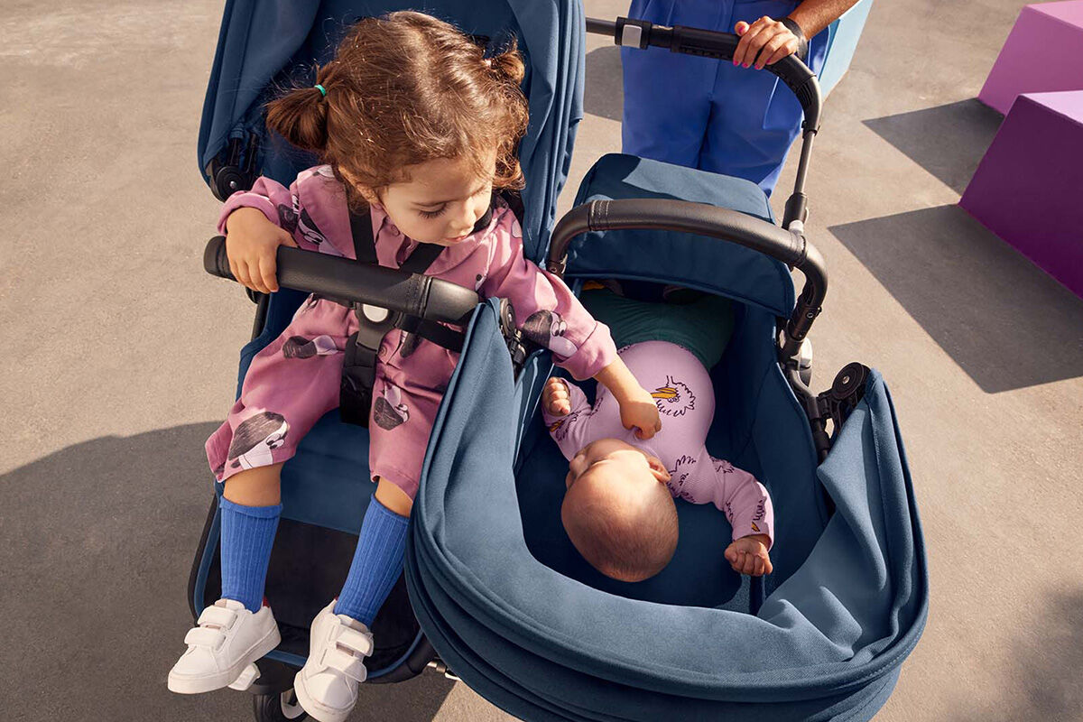 Toddler and baby enjoying a day outdoors in the Bugaboo Donkey 5 Duo double stroller