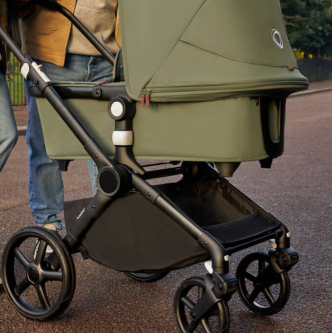 Bugaboo Fox Cub stroller with seat, forest green fabrics and forest green sun canopy.