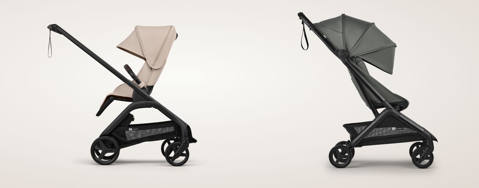 Compact folded Bugaboo stroller standing self-upright in a hallway next to a smiling toddler