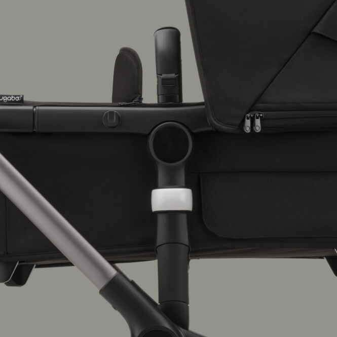 Close up on the Bugaboo bassinet height adapter, raising the bassinet higher from the ground.