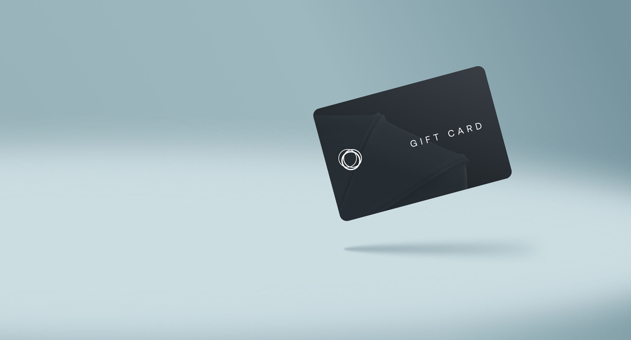A black card with the Bugaboo logo and the text “Gift card”, on a gradient blue background.