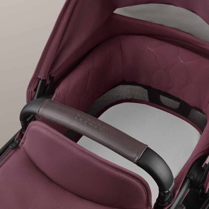 A close-up of the inside of the Bugaboo Kangaroo's bassinet. The fabrics are in Dark Cherry color.