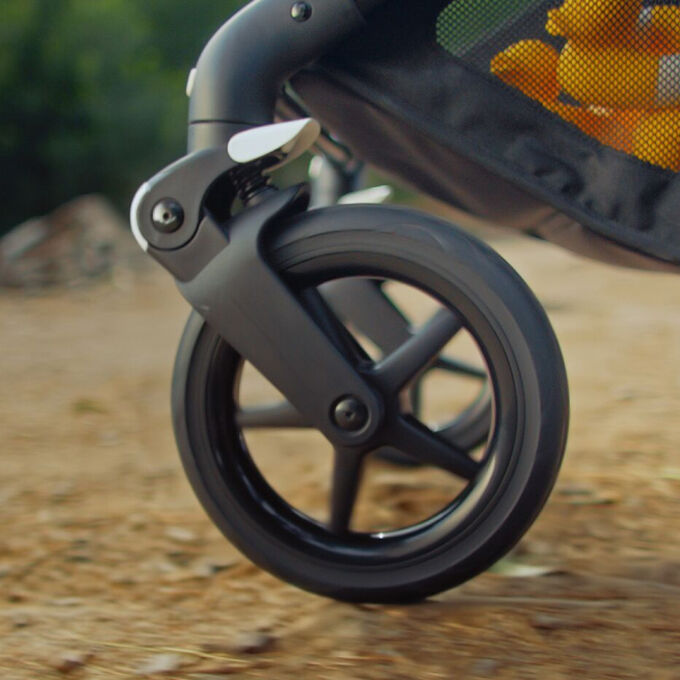Close up on a wheel of a Bugaboo stroller.