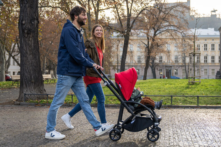 Couple pushing stroller