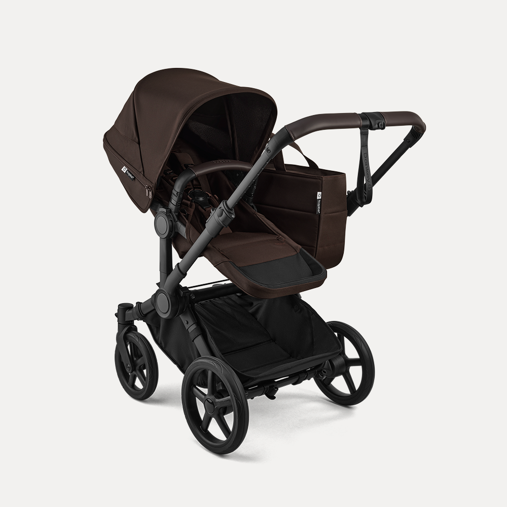 A Bugaboo Donkey 6 stroller in single configuration, featuring a seat and a side bag. The fabrics are in Cocoa Brown.