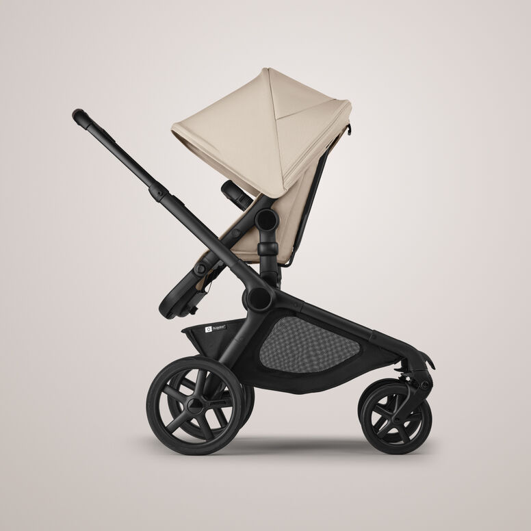 A Bugaboo Kangaroo single-to-double pram in Desert Taupe fabrics, with a seat.