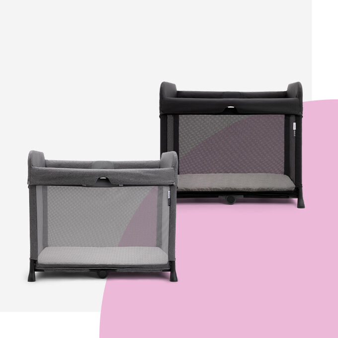 Two Bugaboo Stardust travel cots in grey and black.