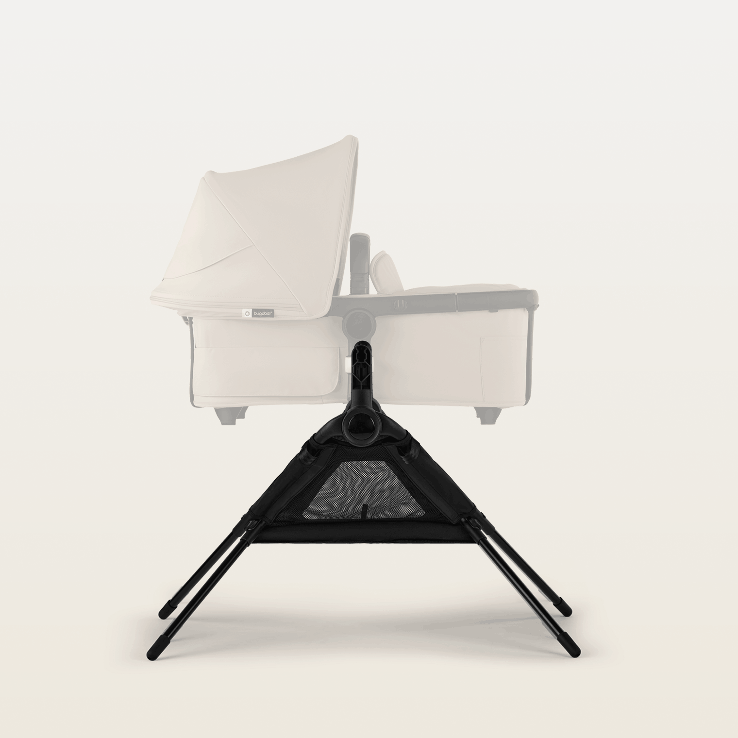 A Bugaboo bassinet stand attached to a Bugaboo bassinet.