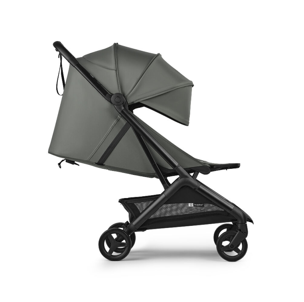 The Bugaboo Butterfly 2 Plus travel stroller in green fabrics, showing the lay-flat seat.