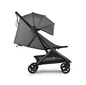 The Bugaboo Butterfly 2 Plus travel stroller in green fabrics, showing the lay-flat seat.