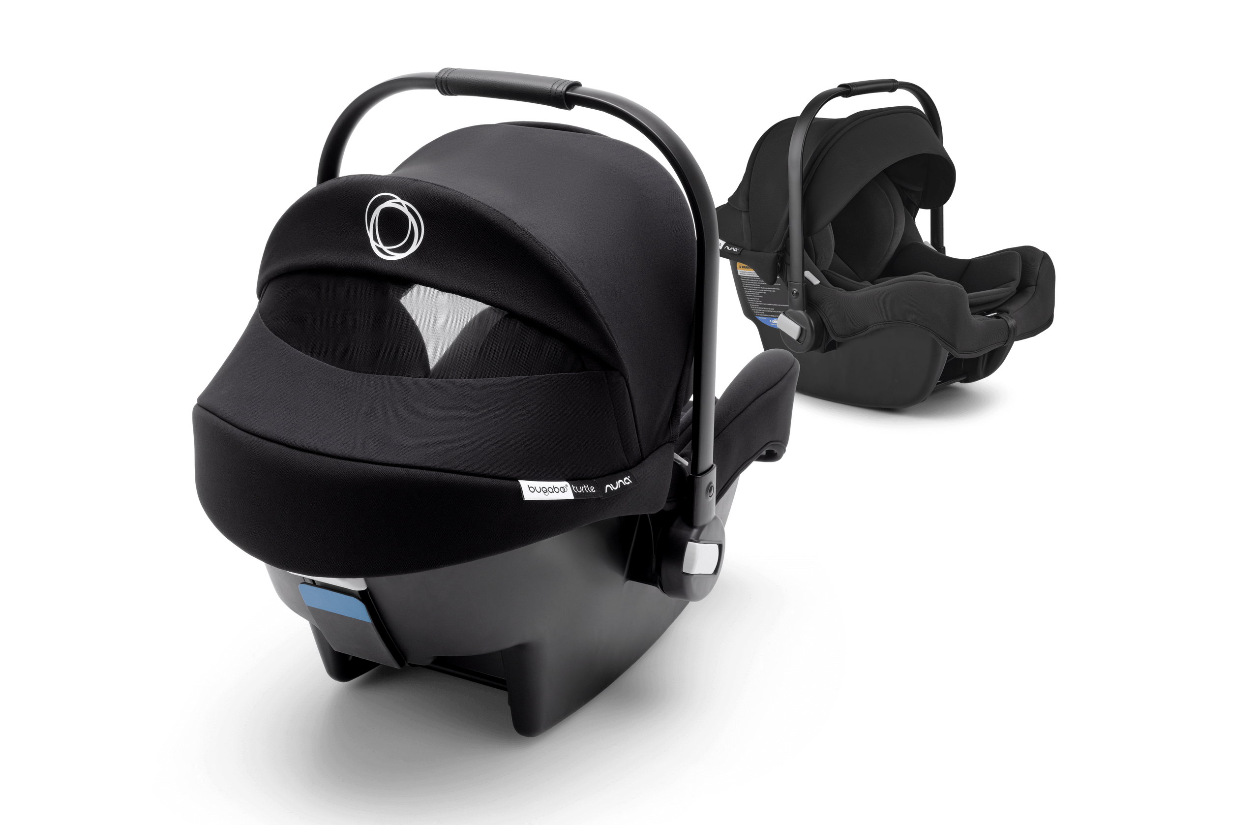 Two Bugaboo Turtle by Nuna car seats in black fabrics.