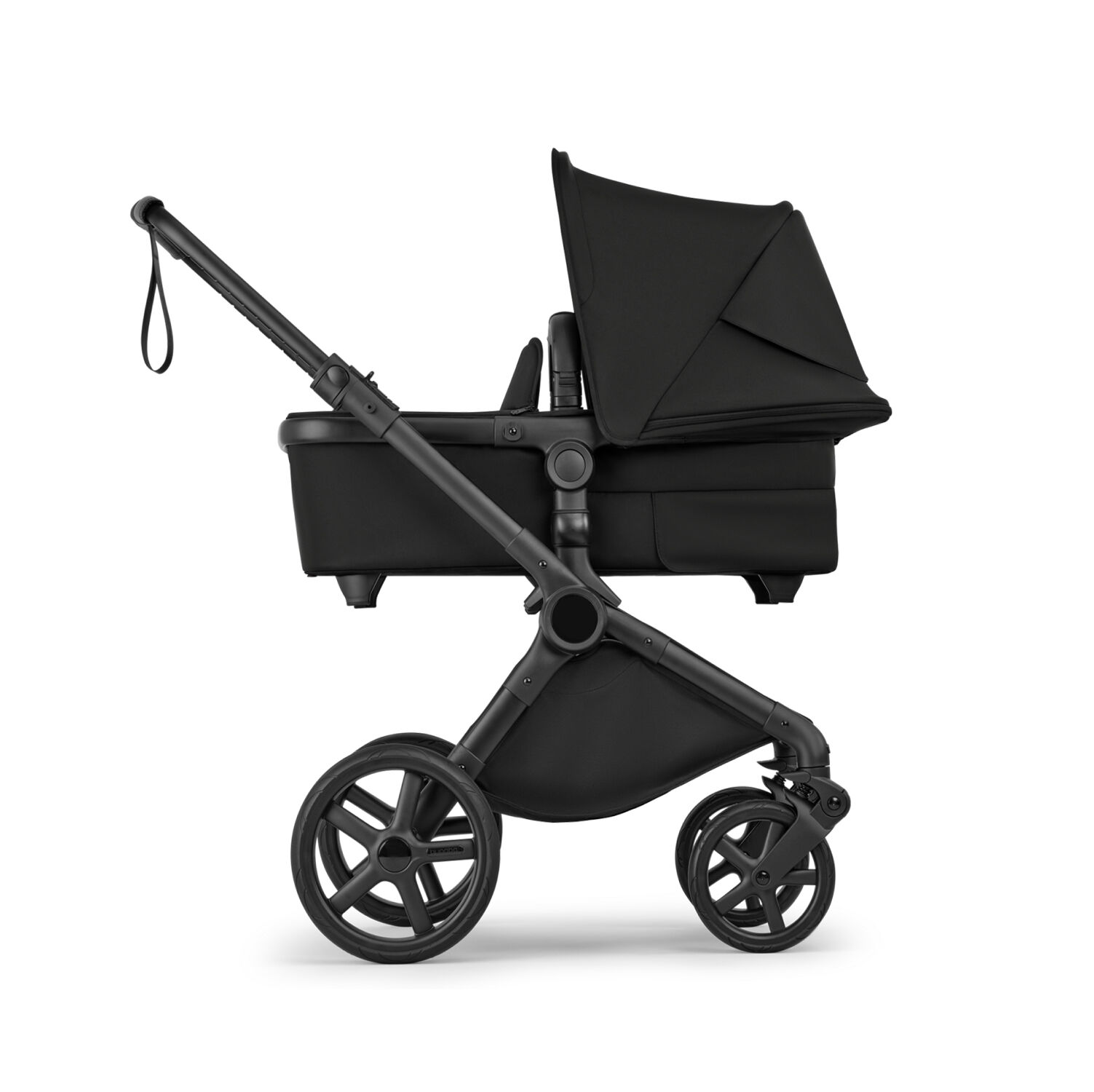 A side view of a Bugaboo Cub all-terrain bassinet stroller in Midnight Black fabrics.