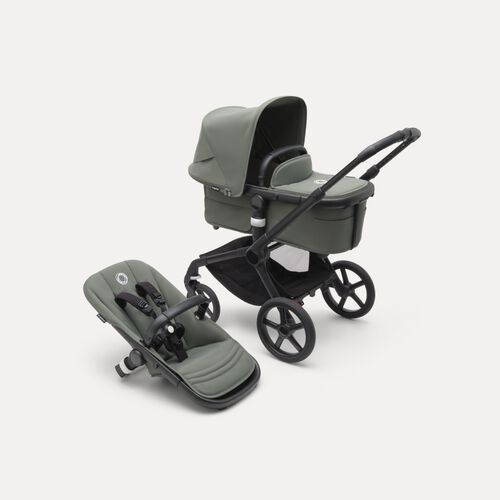A Bugaboo Fox 5 bassinet and seat stroller with green fabrics and a green sun canopy.