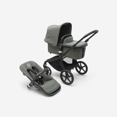 A Bugaboo Fox 5 bassinet and seat stroller with green fabrics and a green sun canopy.