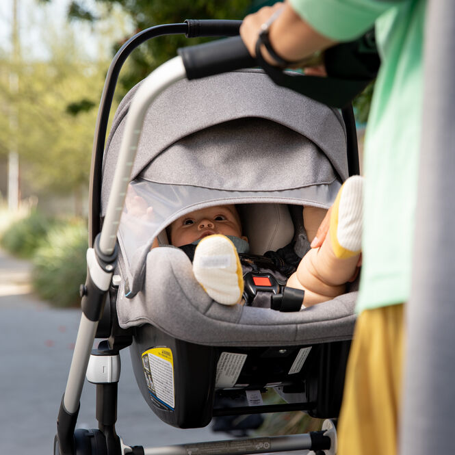 Baby in stroller with sun canopy