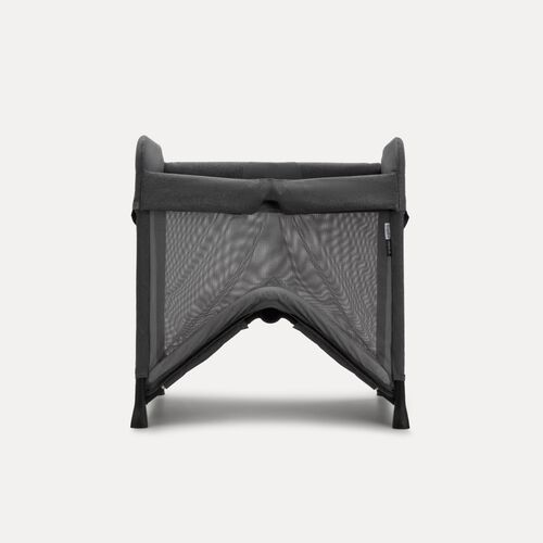 A Bugaboo Stardust travel cot in black fabrics.