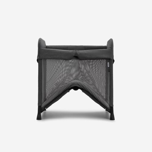 A Bugaboo Stardust travel cot in black fabrics.