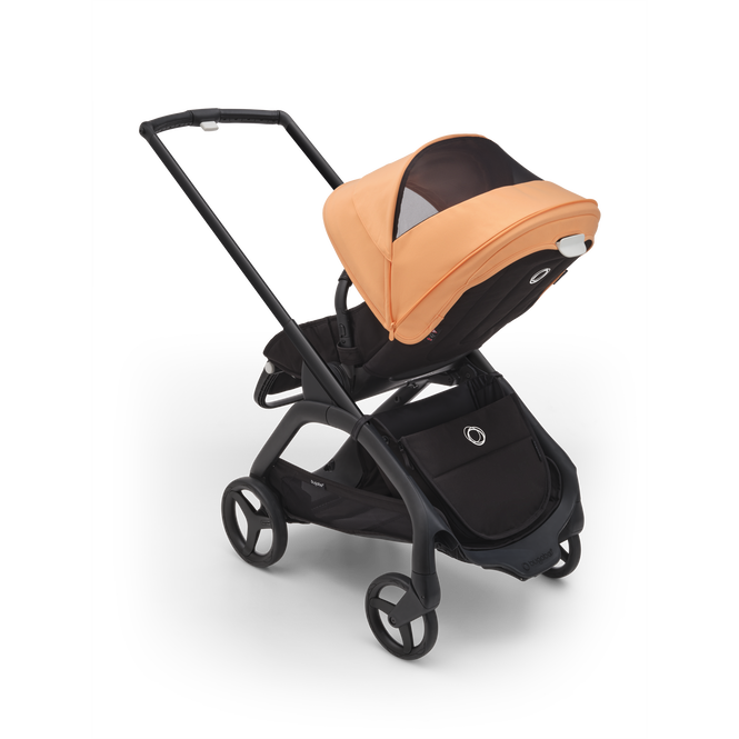 Bugaboo Dragonfly stroller with sun canopy in Island coral color.