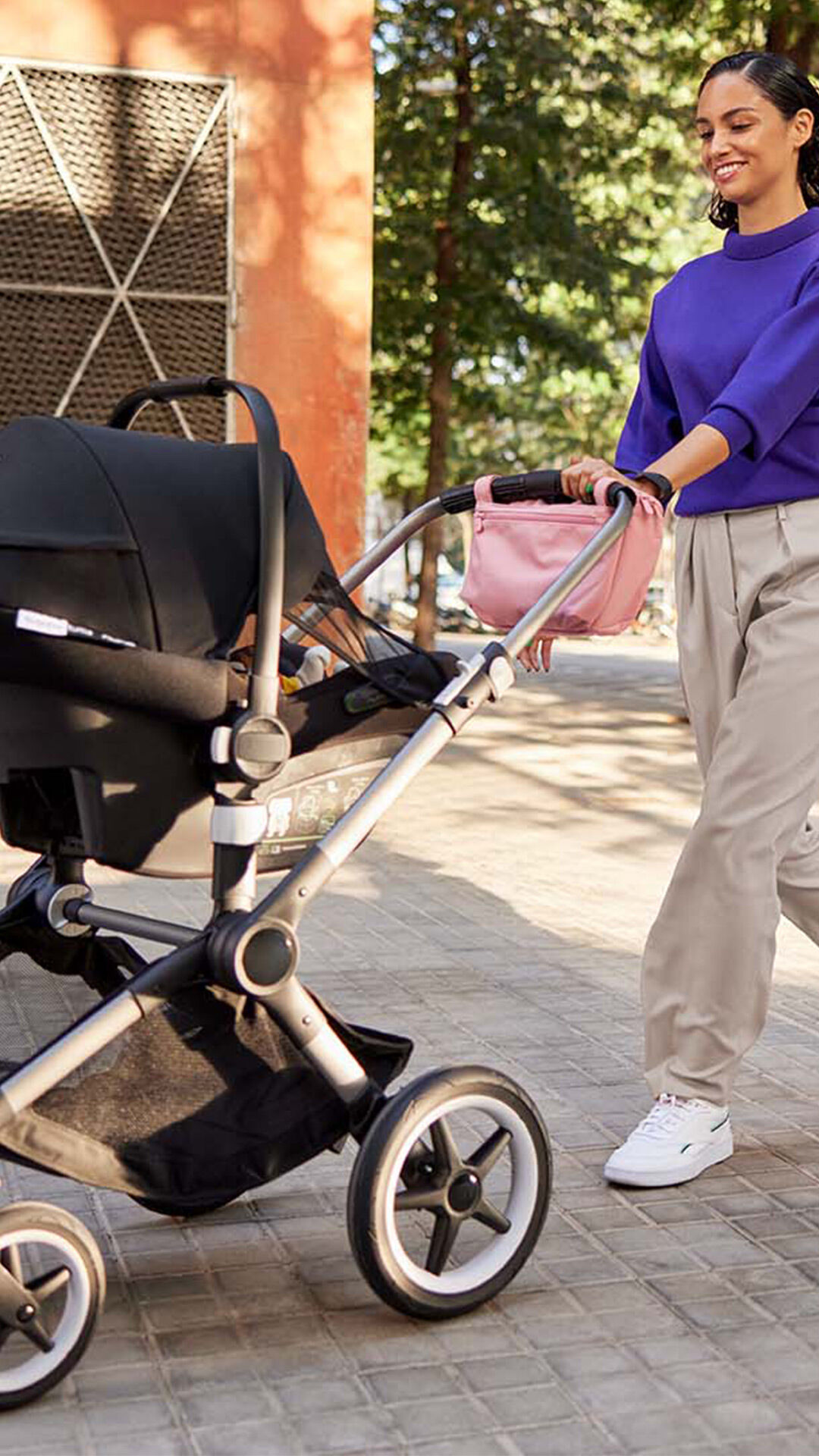 Woman pushing baby in Fox 3 stroller