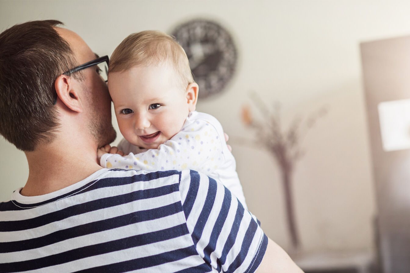 Dad holding baby